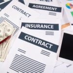 close-up-smartphone-money-graphs-charts-workplace-office-business-concept