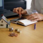 closeup-shot-person-thinking-buying-selling-house