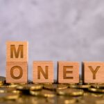 money-word-alphabet-wooden-cube-letters-placed-gold-coin
